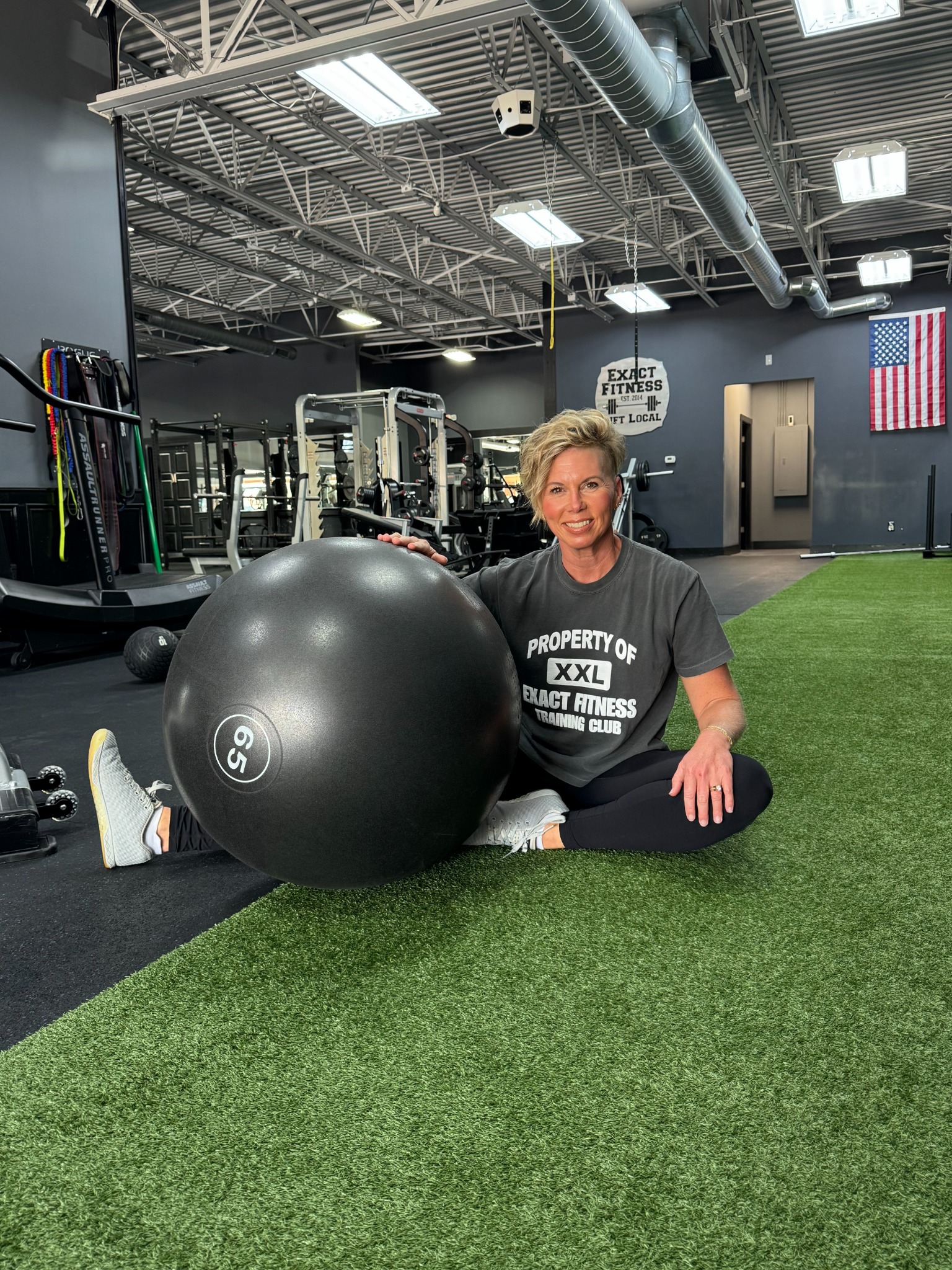 Taryn at Exact Fitness beside the training turf